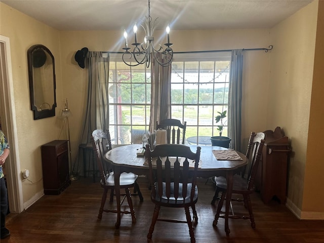 567 N Rice, Hamilton, TX 76531 - dining room featuring a chandelier, wood finished floors, and baseboards