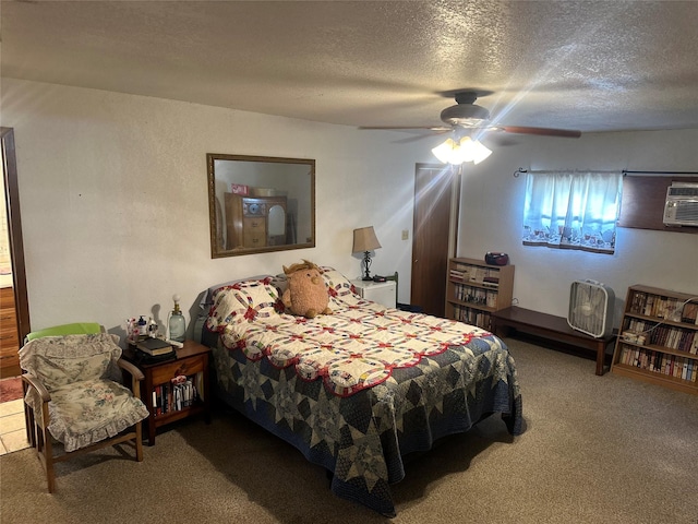 567 N Rice, Hamilton, TX 76531 - bedroom with a textured ceiling, carpet floors, a ceiling fan, and a wall mounted air conditioner