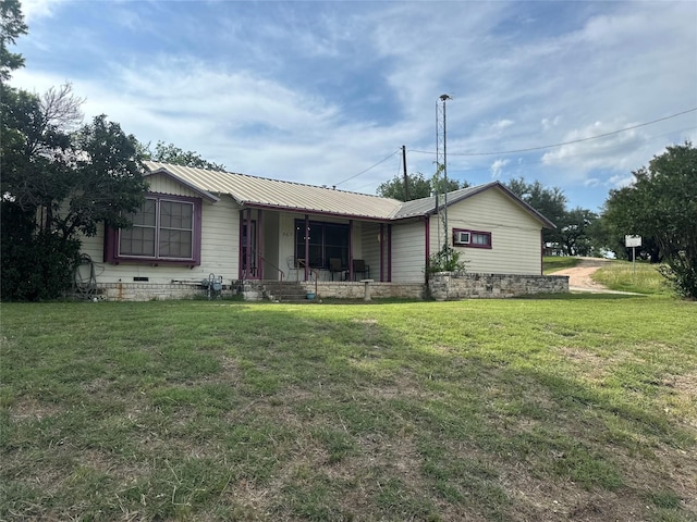567 N Rice, Hamilton, TX 76531 - ranch-style home with a porch, a front lawn, and metal roof
