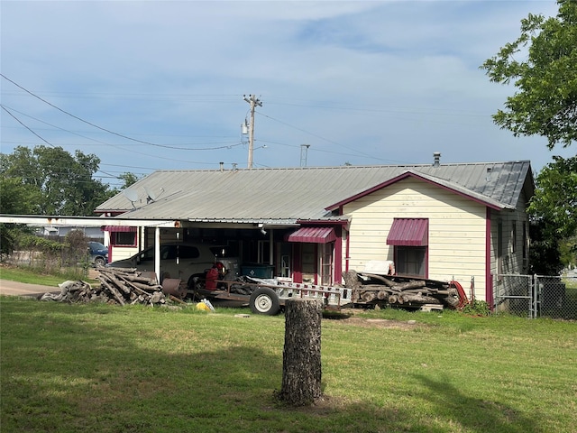 567 N Rice, Hamilton, TX 76531 - back of house with metal roof and a carport