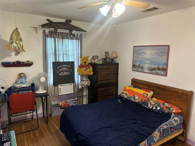 567 N Rice, Hamilton, TX 76531 - bedroom featuring wood finished floors, a ceiling fan, and cooling unit