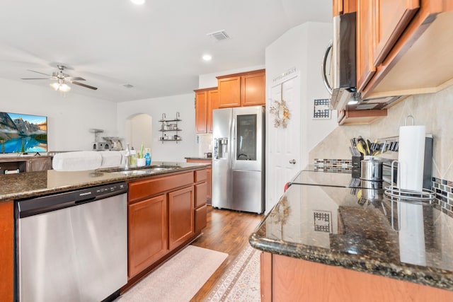 3216 Jackal Dr, Lorena, TX 76655 - kitchen with appliances with stainless steel finishes, ceiling fan, a sink, dark stone counters, and wood finished floors
