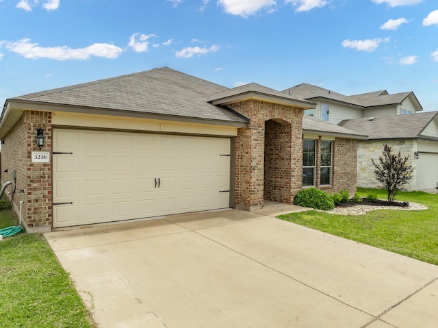 3216 Jackal Dr, Lorena, TX 76655 - single story home featuring brick siding, an attached garage, driveway, a front lawn, and a shingled roof