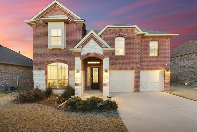 7216 Monet Ln, Grand Prairie, TX 75054 - traditional-style house featuring concrete driveway, an attached garage, and brick siding