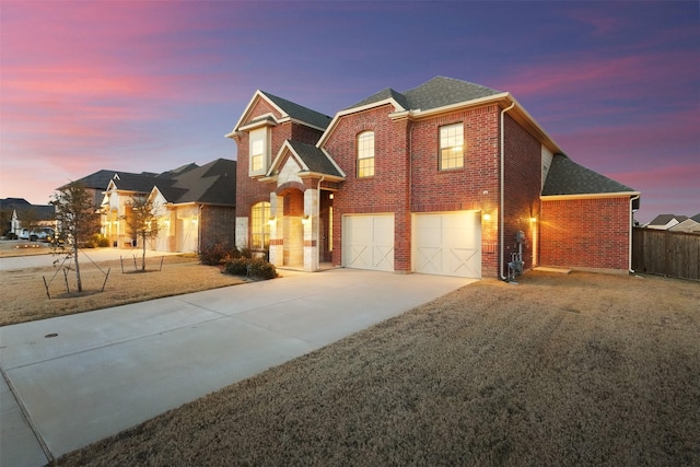 7216 Monet Ln, Grand Prairie, TX 75054 - traditional home with a garage, brick siding, concrete driveway, and a shingled roof