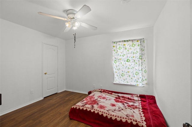 6745 Bear Hollow Ln, Watauga, TX 76137 - bedroom with wood finished floors, baseboards, and a ceiling fan