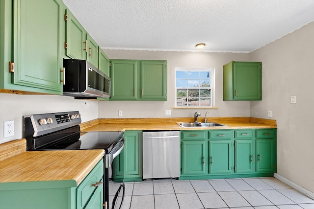 205 Callender Dr, Fort Worth, TX 76108 - kitchen featuring stainless steel appliances, a sink, a textured ceiling, light countertops, and light tile patterned floors