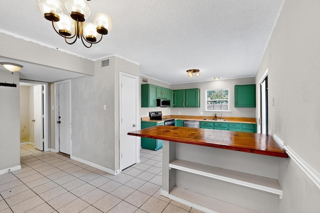 205 Callender Dr, Fort Worth, TX 76108 - kitchen featuring green cabinets, stainless steel appliances, a sink, a textured ceiling, and a chandelier