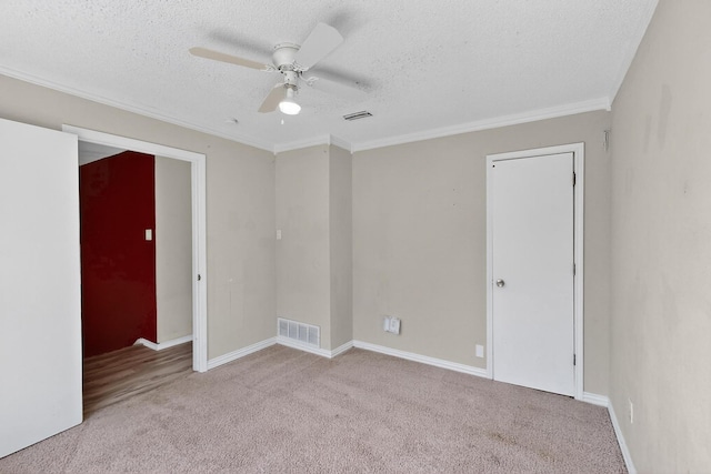 205 Callender Dr, Fort Worth, TX 76108 - spare room with carpet, a textured ceiling, a ceiling fan, ornamental molding, and baseboards
