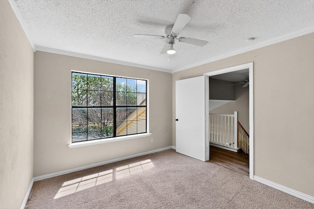205 Callender Dr, Fort Worth, TX 76108 - unfurnished bedroom featuring carpet floors, crown molding, a textured ceiling, baseboards, and a ceiling fan