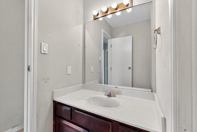 205 Callender Dr, Fort Worth, TX 76108 - bathroom featuring vanity and a textured wall