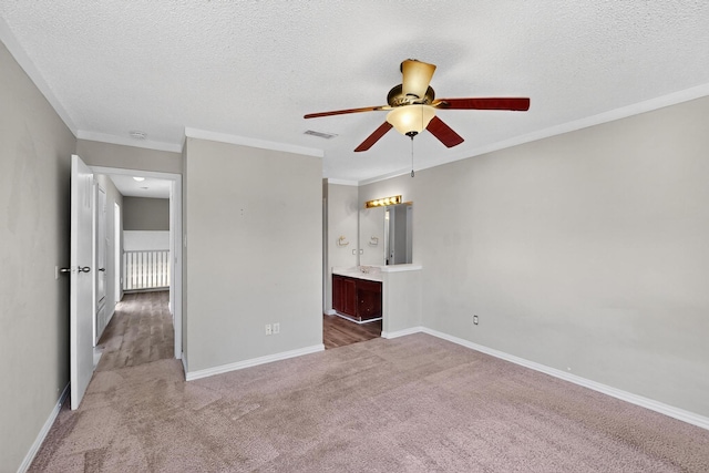 205 Callender Dr, Fort Worth, TX 76108 - unfurnished bedroom featuring carpet floors, a textured ceiling, crown molding, baseboards, and ensuite bath