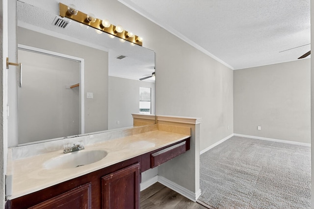 205 Callender Dr, Fort Worth, TX 76108 - bathroom featuring a ceiling fan, vanity, a textured ceiling, baseboards, and wood finished floors