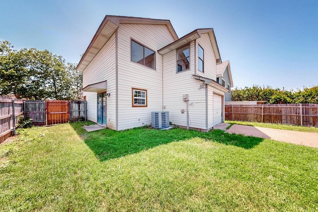 205 Callender Dr, Fort Worth, TX 76108 - back of house featuring driveway, central air condition unit, and a garage