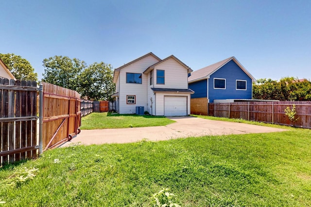 205 Callender Dr, Fort Worth, TX 76108 - back of property featuring concrete driveway, a garage, and central AC unit