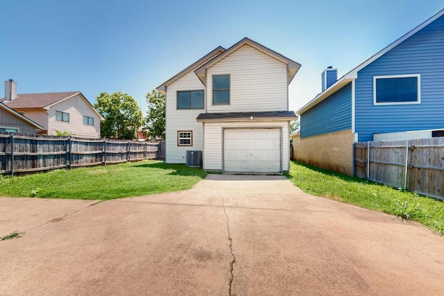 205 Callender Dr, Fort Worth, TX 76108 - rear view of property with central air condition unit, driveway, and an attached garage