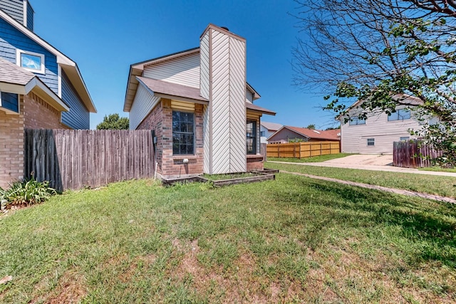 205 Callender Dr, Fort Worth, TX 76108 - back of house featuring brick siding and a chimney