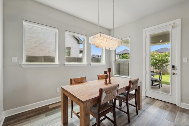 1302 20th St, Northlake, TX 76226 - dining room with baseboards, wood finished floors, and a chandelier