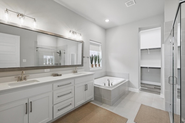 1302 20th St, Northlake, TX 76226 - full bathroom featuring a stall shower, double vanity, a bath, tile patterned flooring, and recessed lighting