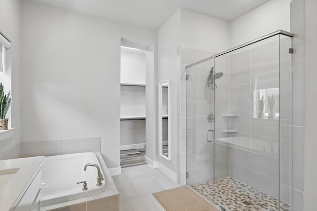 1302 20th St, Northlake, TX 76226 - full bath with a stall shower, a bath, vanity, a spacious closet, and tile patterned floors