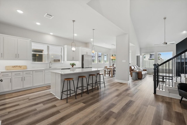 1302 20th St, Northlake, TX 76226 - kitchen featuring freestanding refrigerator, a sink, open floor plan, a center island, and white cabinets