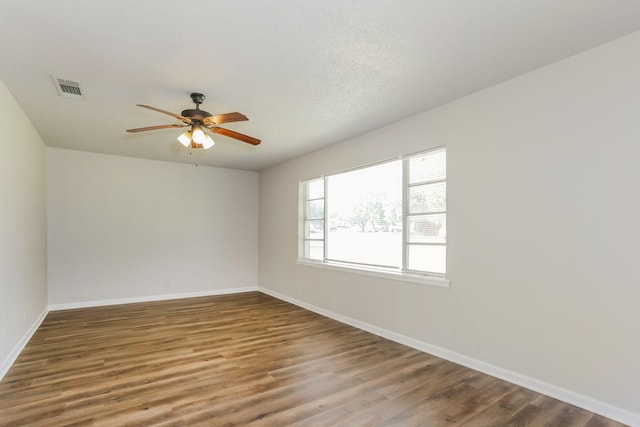 5113 Bob Dr, North Richland Hills, TX 76180 - empty room featuring a ceiling fan, baseboards, and wood finished floors