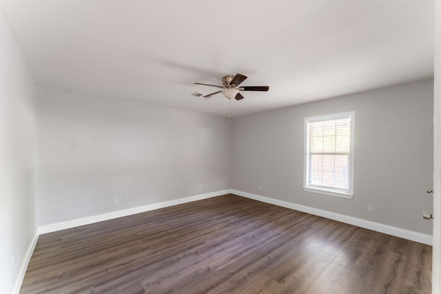 2835 Gladstone Dr, Dallas, TX 75211 - empty room featuring a ceiling fan, dark wood finished floors, and baseboards