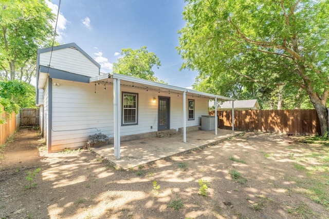2835 Gladstone Dr, Dallas, TX 75211 - rear view of property featuring a fenced backyard and a patio area