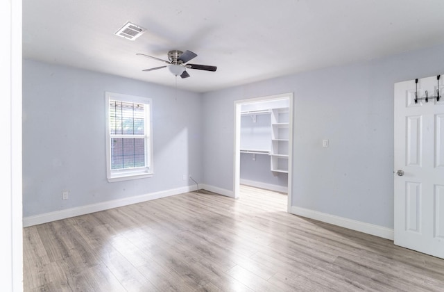 2835 Gladstone Dr, Dallas, TX 75211 - spare room with a ceiling fan, wood finished floors, and baseboards