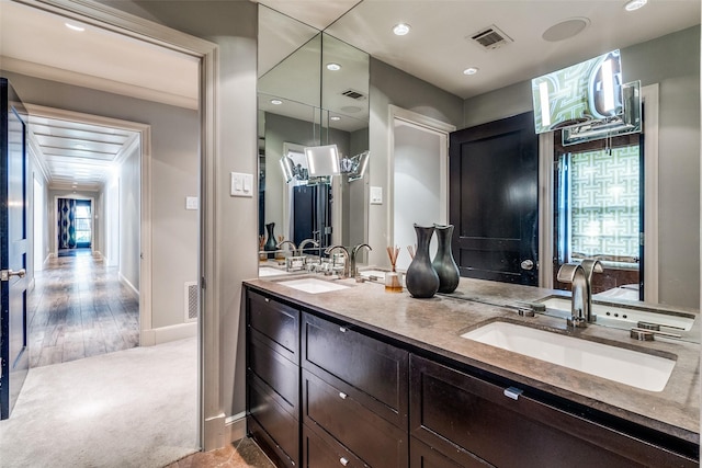 3241 Merrell Cir, Dallas, TX 75229 - bathroom with double vanity, plenty of natural light, baseboards, and recessed lighting