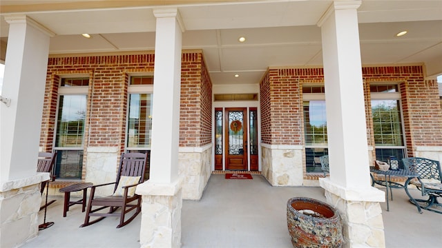 35 Oakland Hills Ct, Graford, TX 76449 - entrance to property featuring brick siding, a porch, and stone siding