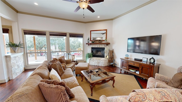 35 Oakland Hills Ct, Graford, TX 76449 - living area with a stone fireplace, ornamental molding, ceiling fan, wood finished floors, and recessed lighting