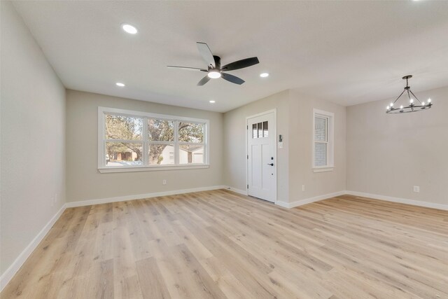 4955 Odessa Ave, Fort Worth, TX 76133 - empty room featuring light wood finished floors, a chandelier, a ceiling fan, baseboards, and recessed lighting