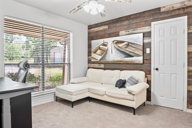 483 County Road 1591, Sunset, TX 76270 - living room featuring carpet floors, plenty of natural light, a ceiling fan, and wood walls