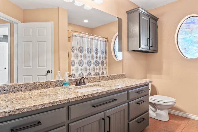 483 County Road 1591, Sunset, TX 76270 - full bath featuring vanity, toilet, tile patterned flooring, baseboards, and a shower with curtain