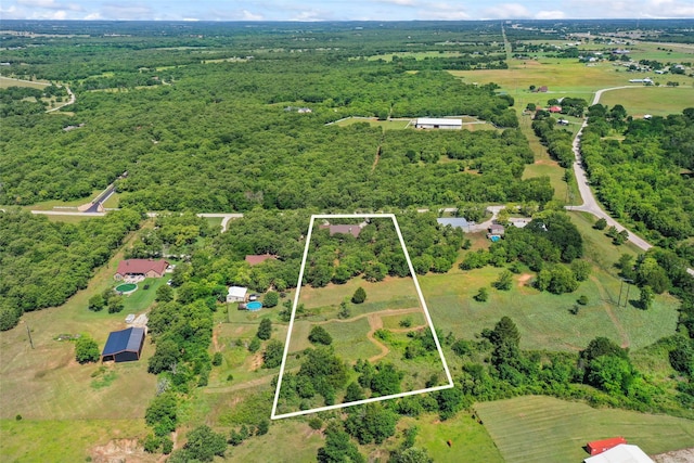 483 County Road 1591, Sunset, TX 76270 - aerial view of property and surrounding area featuring property boundaries highlighted and a forest