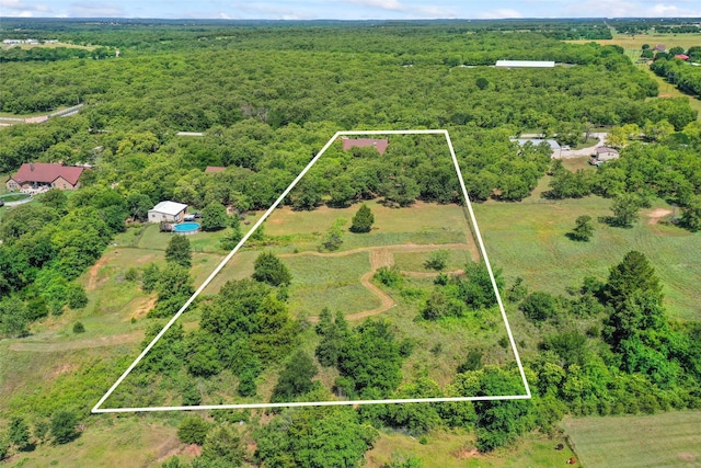 483 County Road 1591, Sunset, TX 76270 - aerial overview of property's location with property parcel outlined and a heavily wooded area