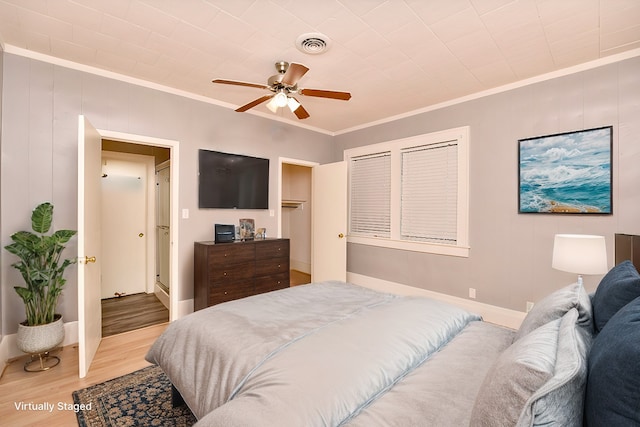 307 Smith St, Hillsboro, TX 76645 - bedroom with crown molding, light wood-type flooring, baseboards, and ceiling fan
