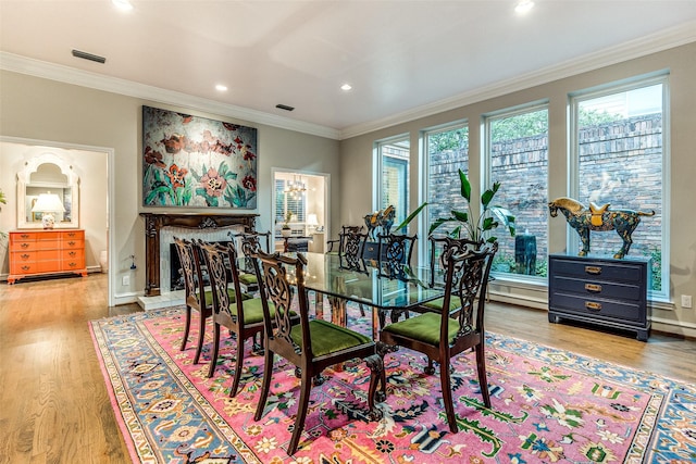10 Carmarthen Ct, Dallas, TX 75225 - dining area with healthy amount of natural light, light wood finished floors, crown molding, recessed lighting, and baseboards