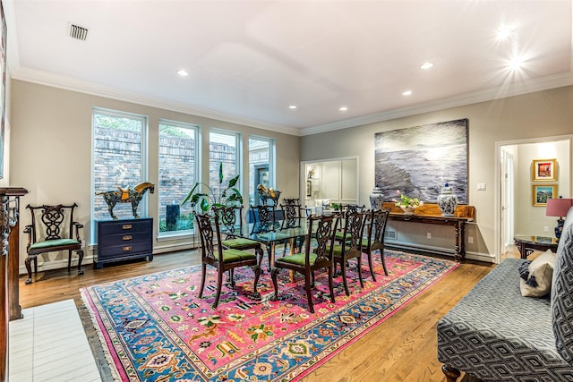 10 Carmarthen Ct, Dallas, TX 75225 - dining space featuring wood finished floors, ornamental molding, recessed lighting, and baseboards