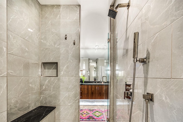 10 Carmarthen Ct, Dallas, TX 75225 - full bath featuring tiled shower, vanity, and tile walls