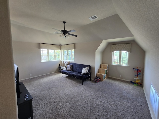 9924 Chrysalis Dr, Fort Worth, TX 76131 - living area featuring healthy amount of natural light, lofted ceiling, a textured ceiling, ceiling fan, and carpet floors