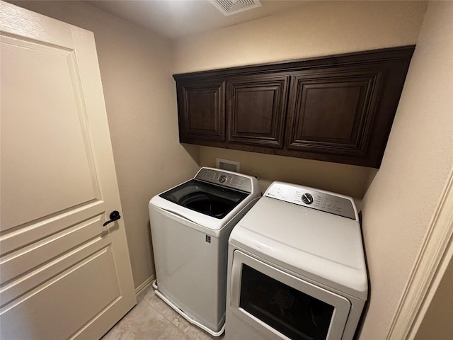 9924 Chrysalis Dr, Fort Worth, TX 76131 - laundry room featuring independent washer and dryer, cabinet space, and light tile patterned floors
