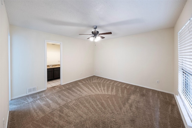 6900 Tudor Dr, Plano, TX 75023 - unfurnished room with light carpet, a ceiling fan, baseboards, and a sink