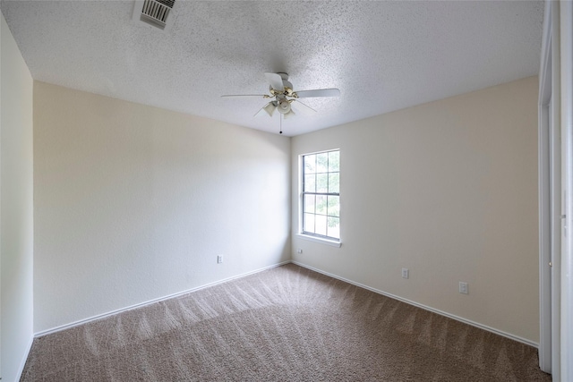 6900 Tudor Dr, Plano, TX 75023 - carpeted empty room featuring a ceiling fan, baseboards, and a textured ceiling