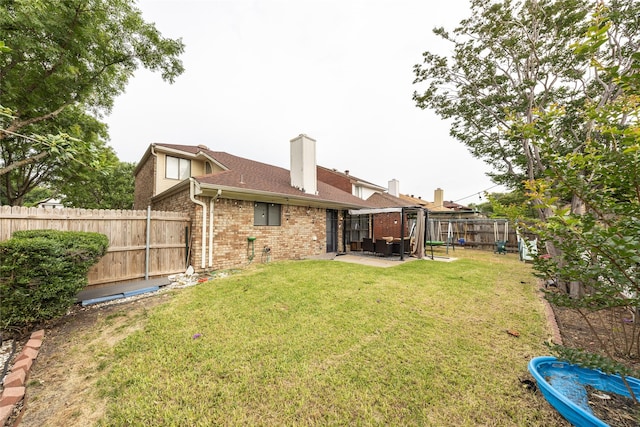 6900 Tudor Dr, Plano, TX 75023 - rear view of property with brick siding, a patio area, and a chimney