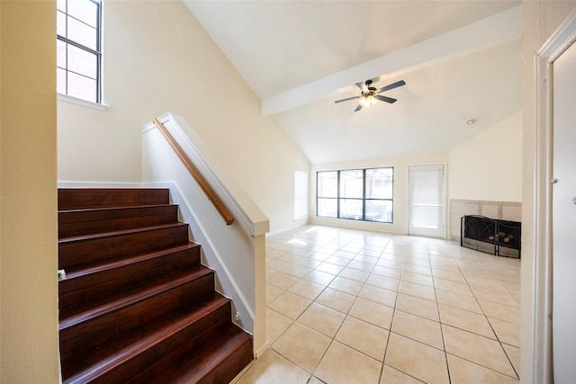 6900 Tudor Dr, Plano, TX 75023 - staircase featuring a ceiling fan, healthy amount of natural light, and tile patterned flooring
