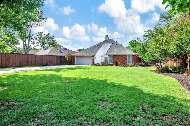 2203 Glascow Ct, Carrollton, TX 75007 - view of front of house featuring an attached garage, brick siding, concrete driveway, and a chimney