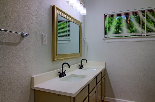 3404 Alhambra Dr, Forest Hill, TX 76119 - bathroom featuring double vanity and a textured wall