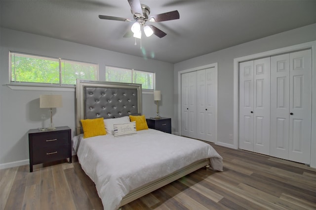 3404 Alhambra Dr, Forest Hill, TX 76119 - bedroom featuring wood finished floors, two closets, baseboards, and ceiling fan
